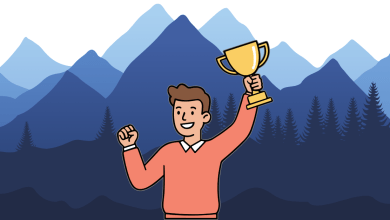 Image of guy holding a trophy in front of mountains